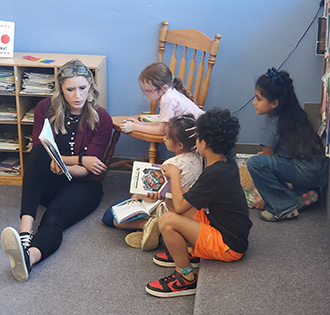 teacher reading to a student